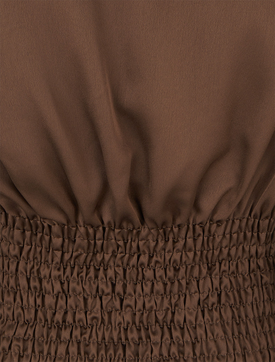 Close-up detail of the elasticated smocked back panel texture