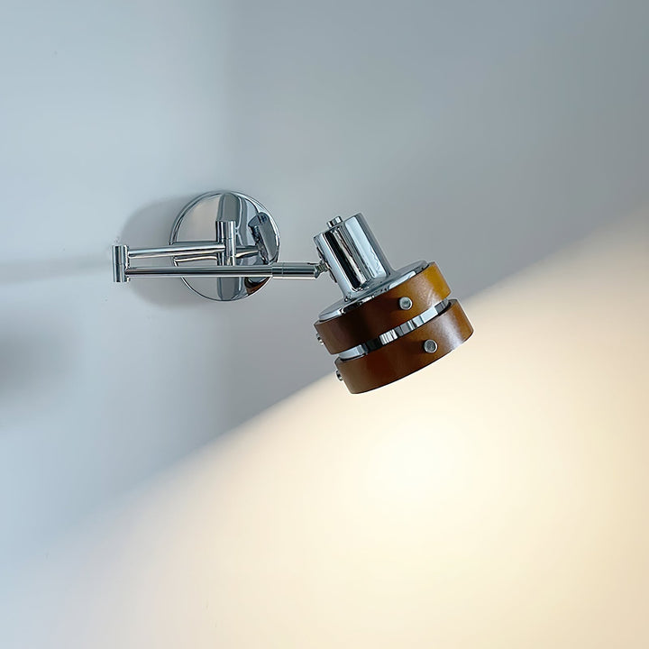 Flare Chrome Wood Mid-Century Wall Light illuminated in a room