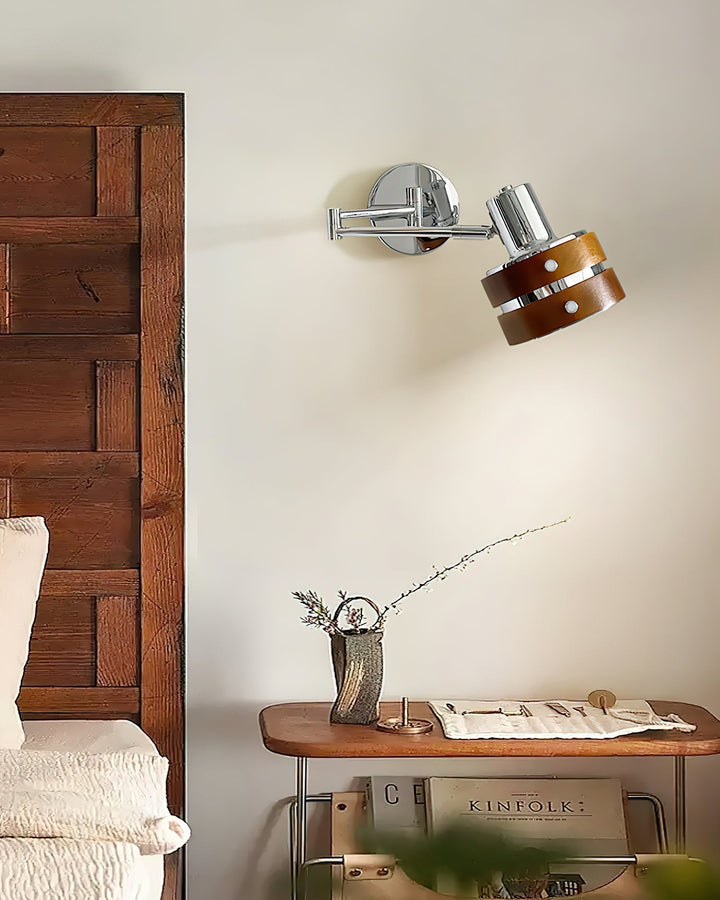 Mid-century lighting fixture shown against a neutral accent wall
