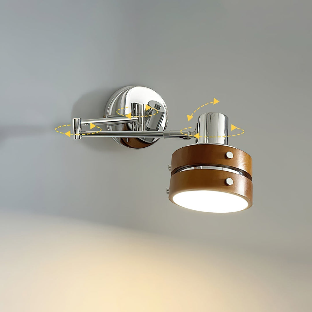 Close-up of the polished chrome shade on the wooden wall light