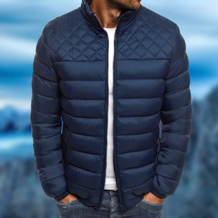 Men wearing a dark blue quilted winter jacket outdoors