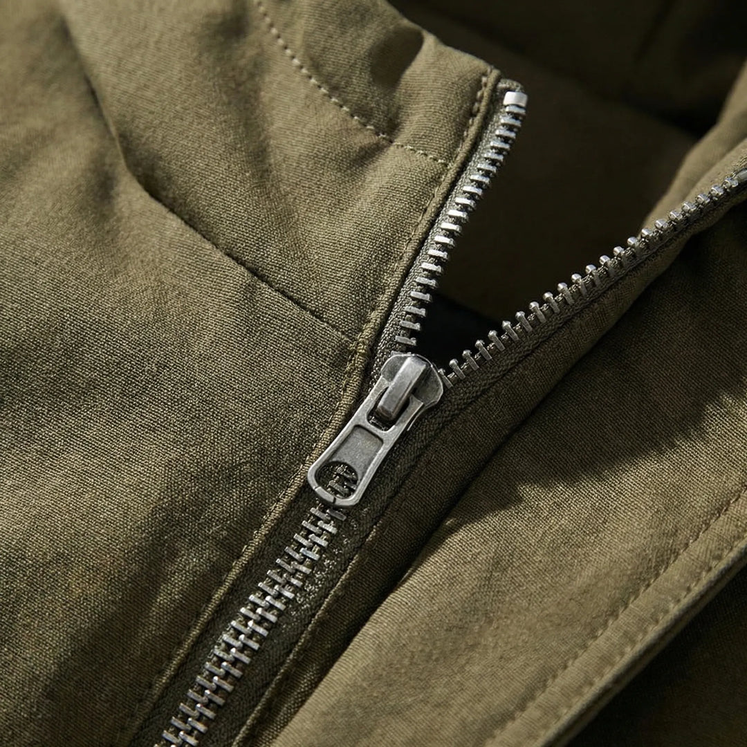 Close-up detail of the durable metal zipper on the parka coat