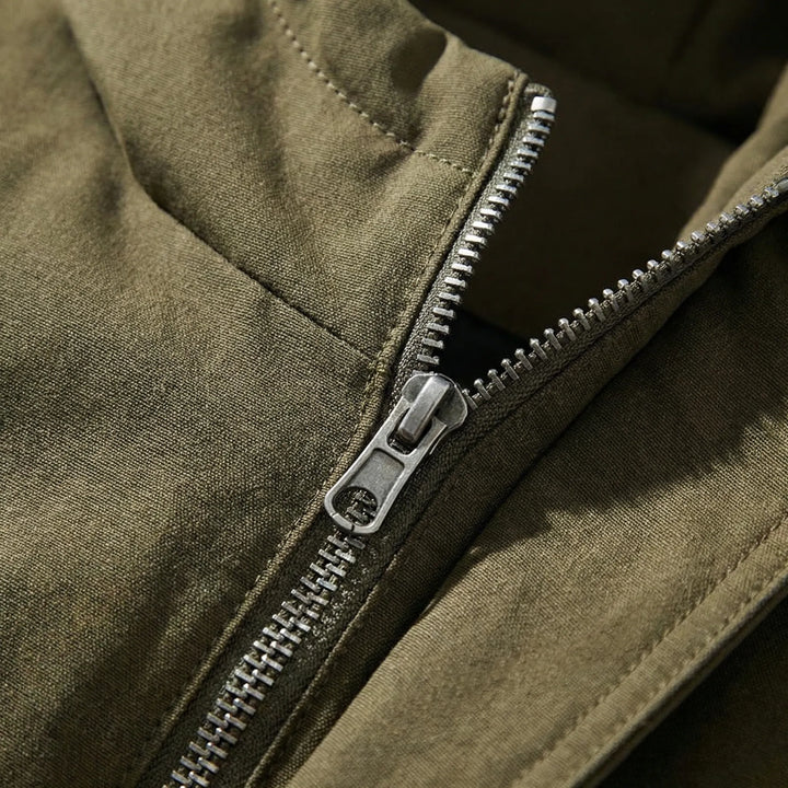 Close-up detail of the durable metal zipper on the parka coat