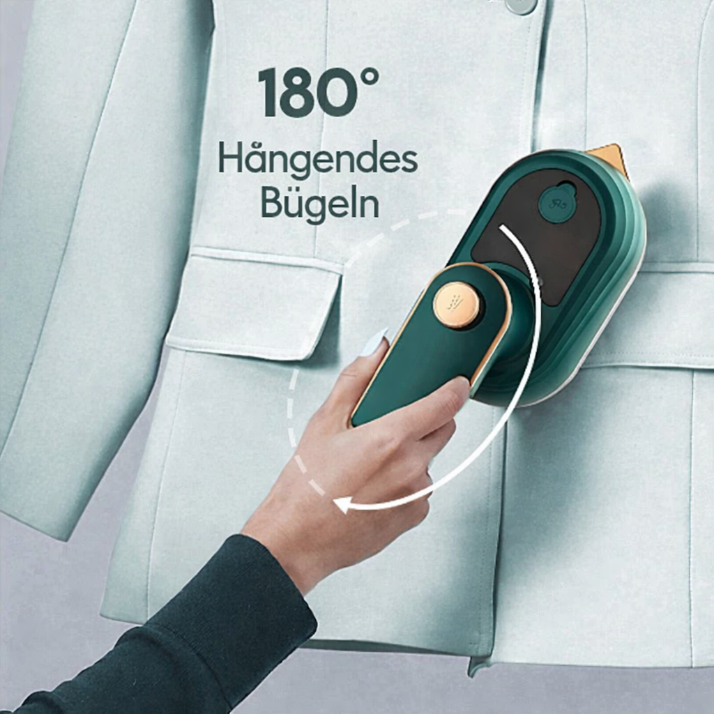 Hand holding portable green steam iron against a light garment
