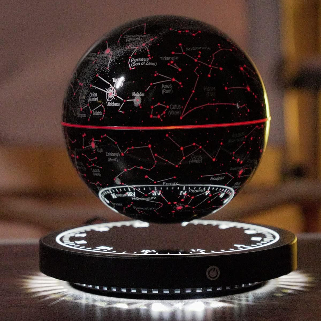 Red-illuminated magnetic levitation star map lamp casting a warm celestial glow