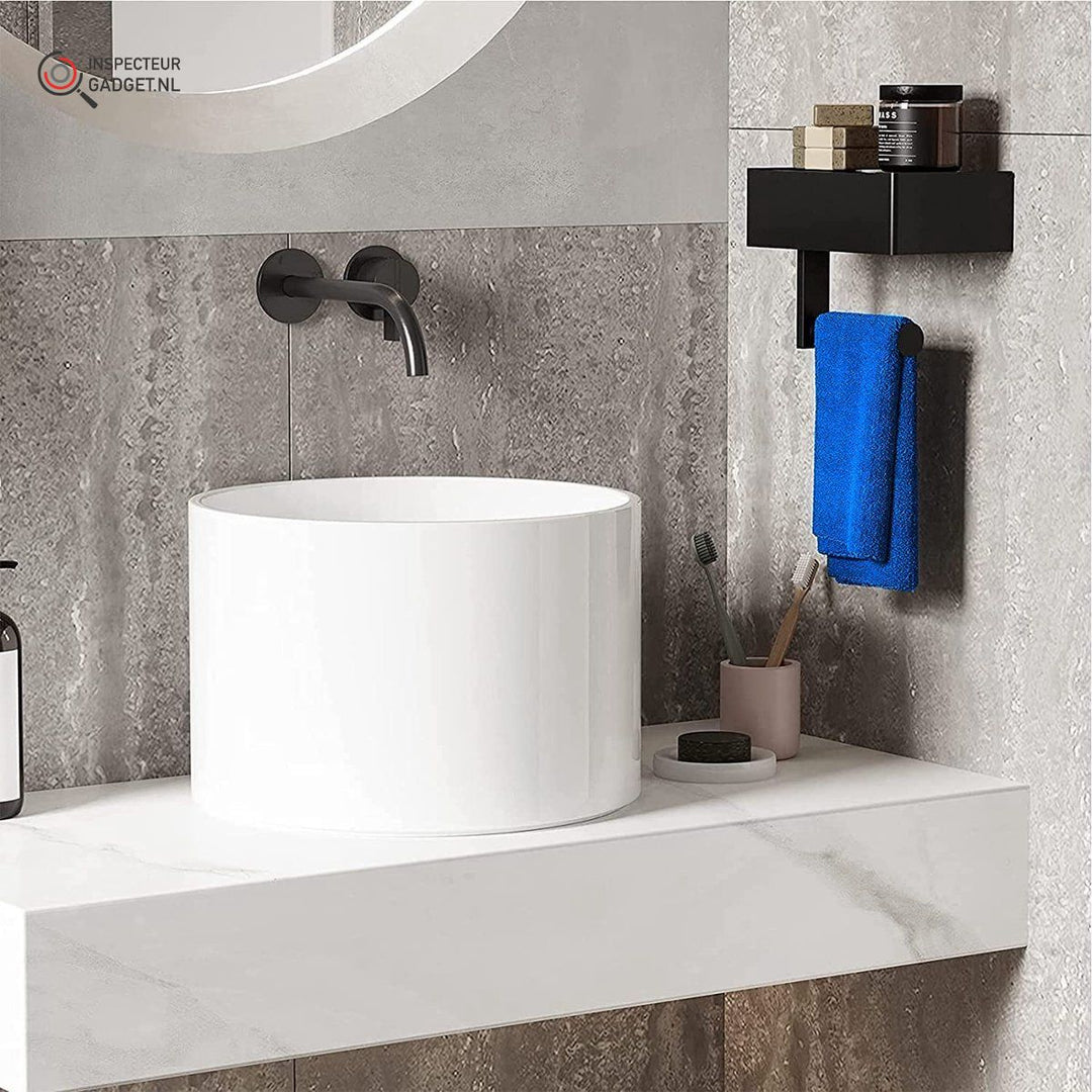 Minimalist black bathroom roll and towel holder mounted above a modern white sink