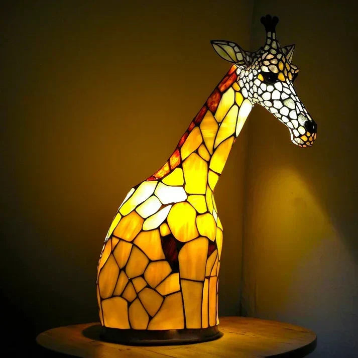 Detailed animal table lamp casting colorful patterns as a nightlight