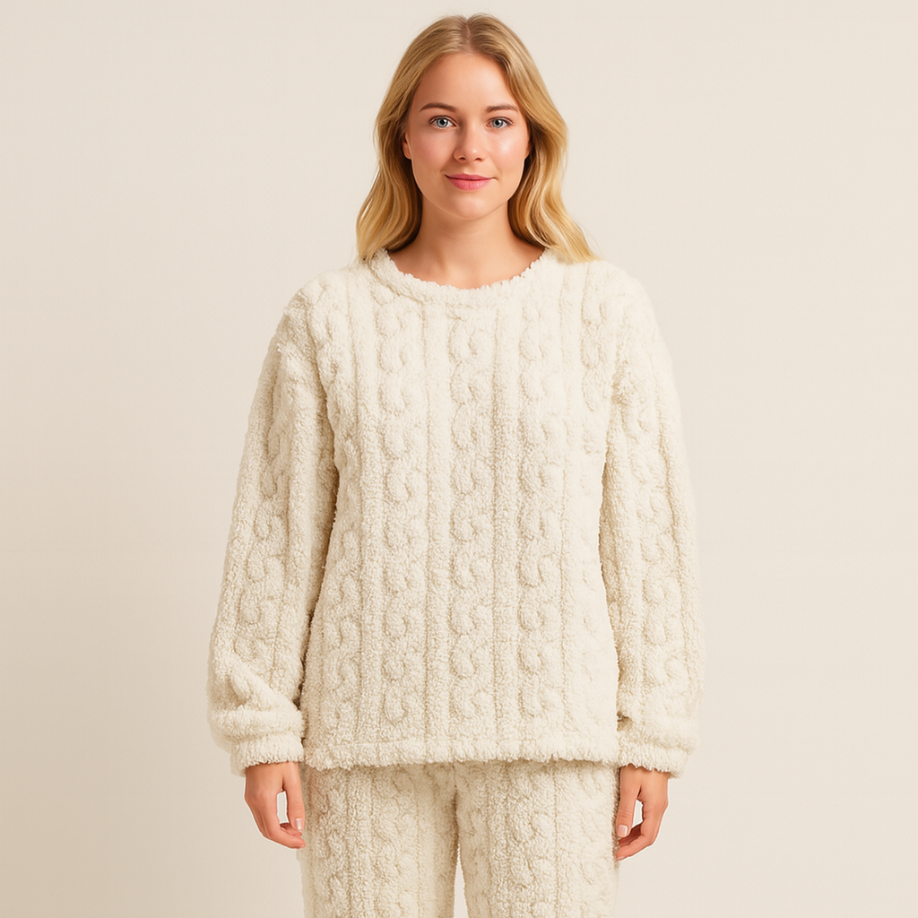 Woman wearing a cream textured long-sleeved pyjama set studio portrait