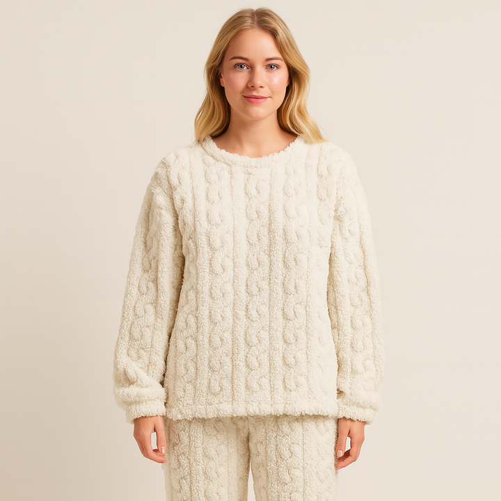 Woman wearing a cream textured long-sleeved pyjama set studio portrait