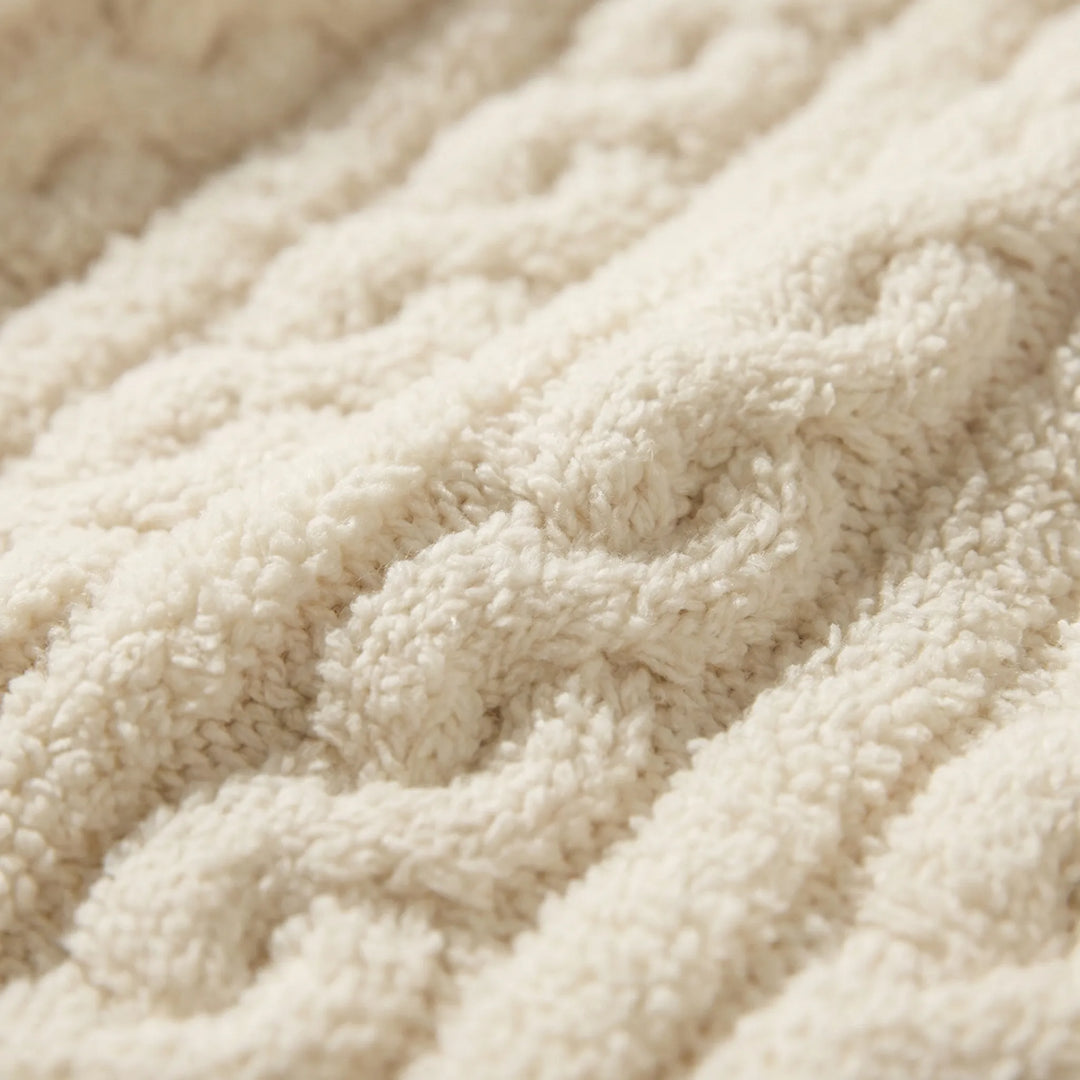Close-up view of the soft, textured cable knit fabric of the pyjama set