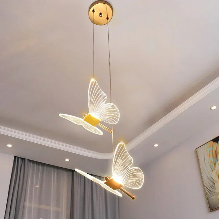 LED butterfly pendant light hanging from a modern ceiling