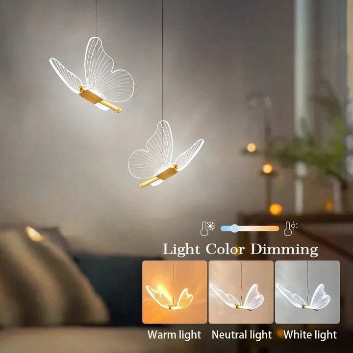 Modern LED butterfly pendant light casting warm illumination over a dining room table