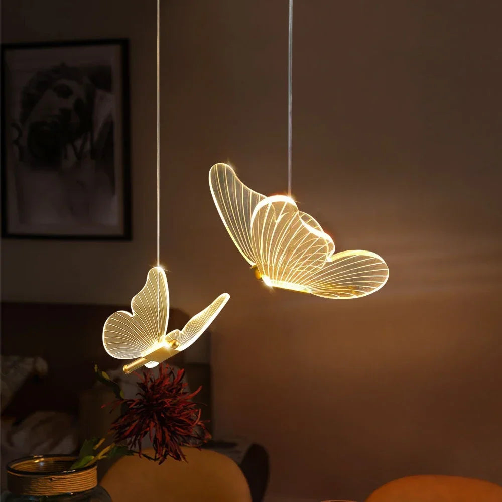 Close up view of illuminated butterfly pendant fixtures
