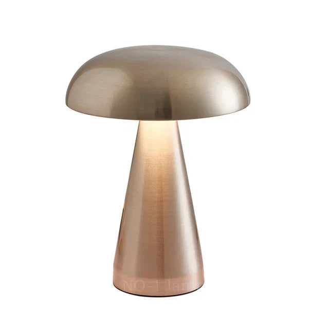 Metallic Vespera Luxe table lamp illuminating a cozy bedside nightstand