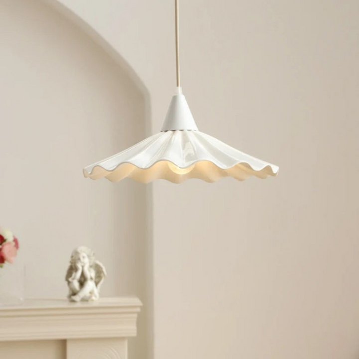 Minimalist kitchen lighting with a white textured pendant lamp hanging down