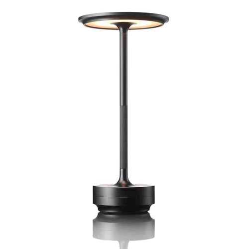 Rechargeable ambient lighting lamp placed on a wooden nightstand