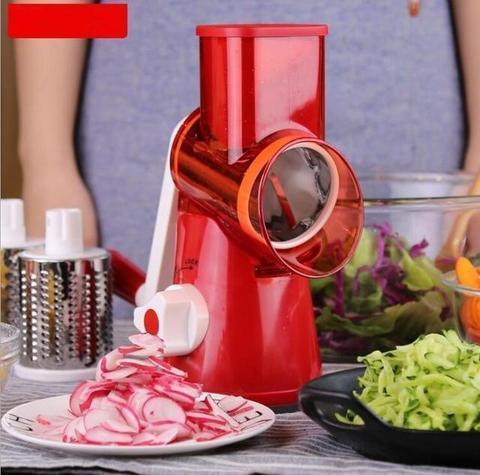 Red vegetable slicer preparing fresh sliced radishes on a plate