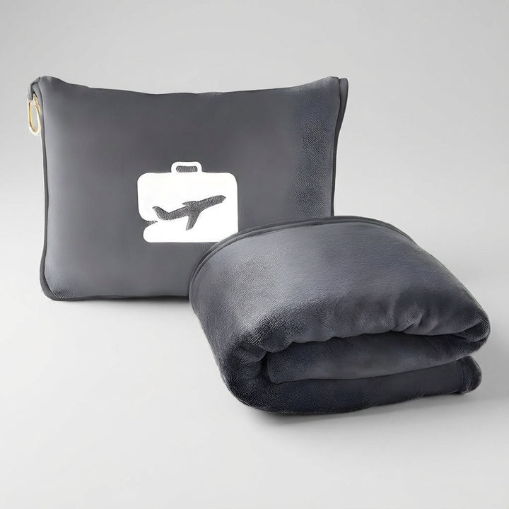 Essential flight accessories including a warm travel blanket and neck pillow