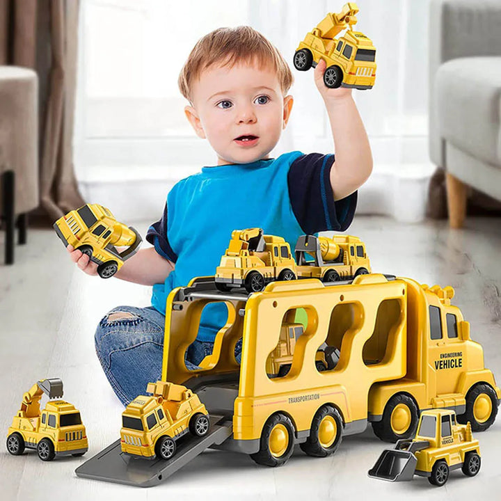 Toddler playing with yellow light and sound toy truck set