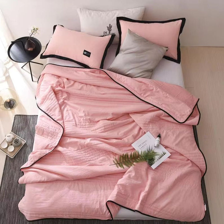 Detailed shot of the durable hem and cooling weave on the blanket