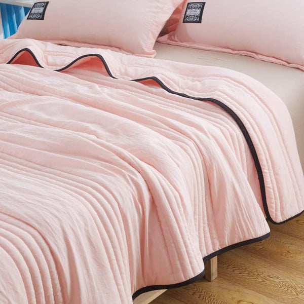 Close-up view of the soft woven fabric texture on the lightweight throw