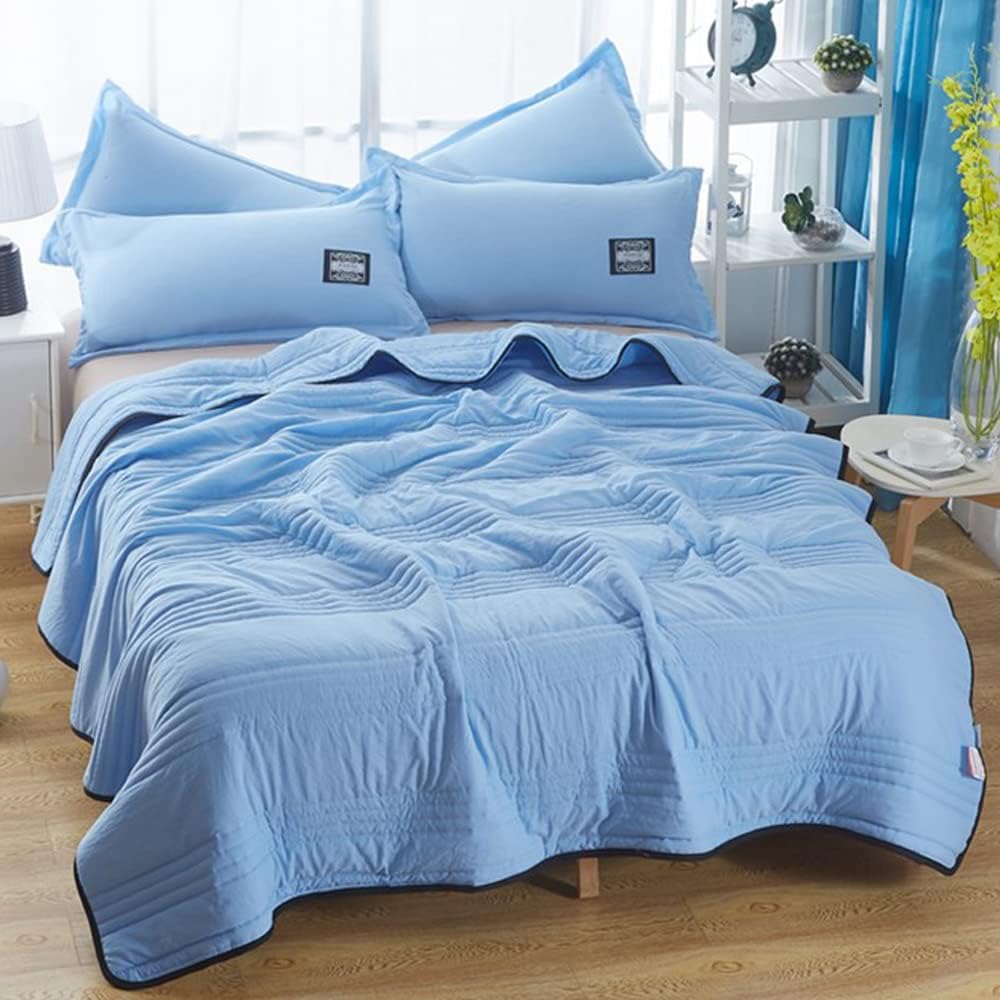 Airy breathable bedding blanket showcased in a bright sunlit interior