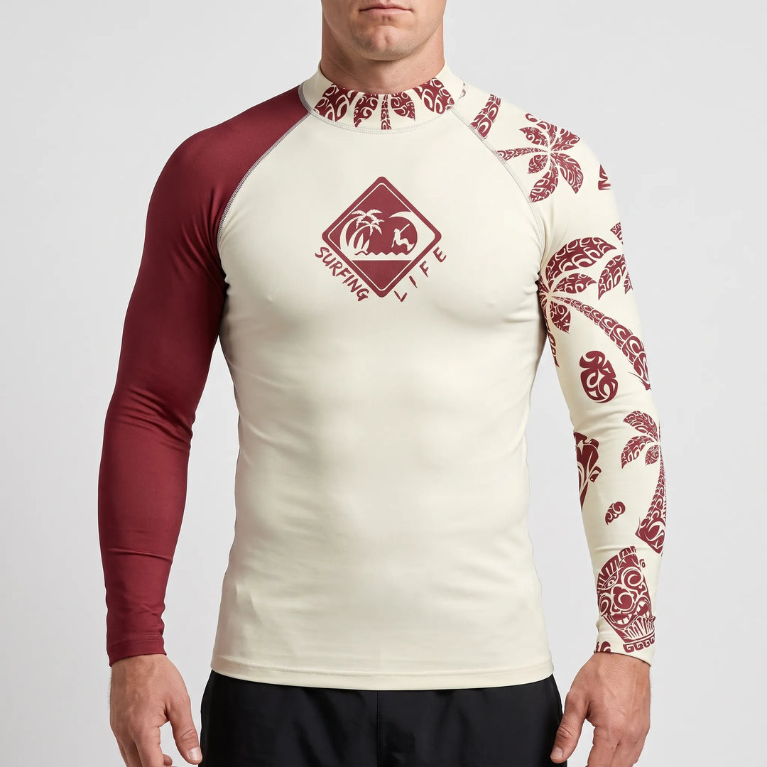 Studio shot of a man wearing a wine red and cream long sleeve surf rash guard
