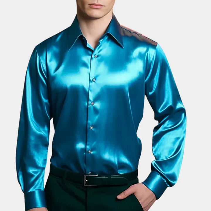 Man wearing a bright blue button-down shirt paired with dark trousers