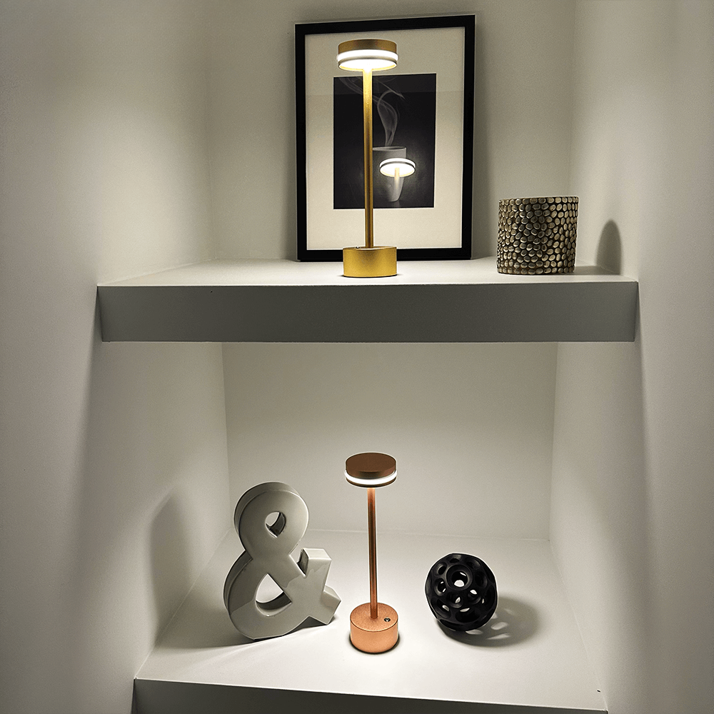 Cordless aluminum table lamp showing touch control button for wireless LED lighting