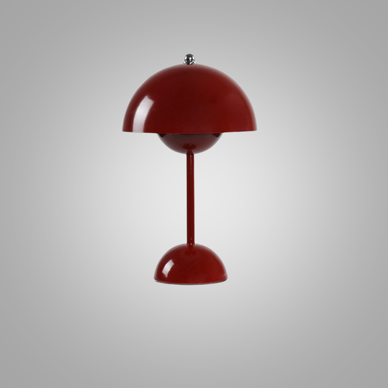 Studio shot of the red adjustable brightness table lamp against a neutral background