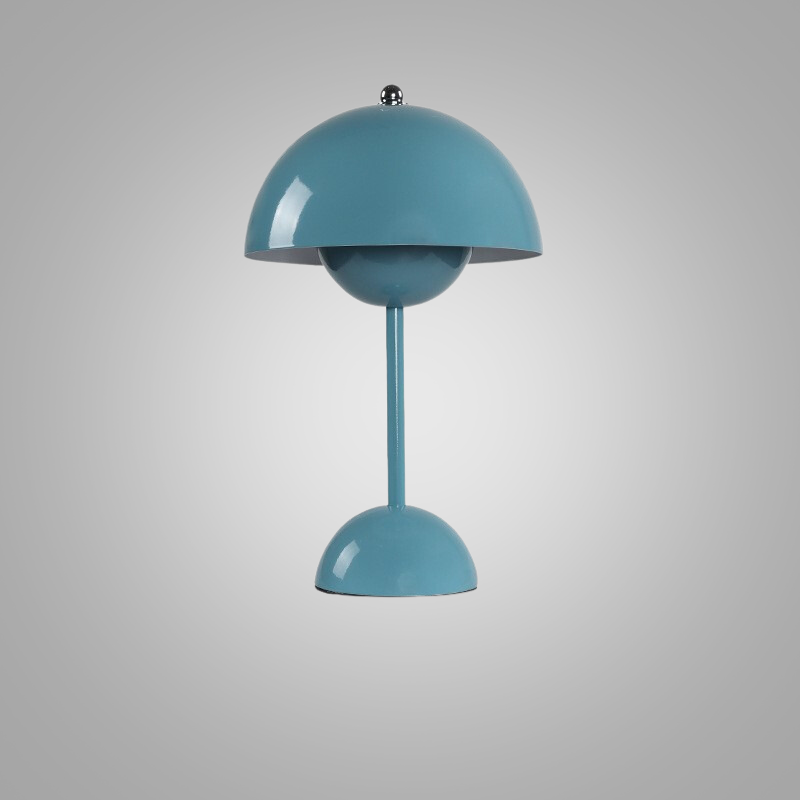 Studio shot of the sky blue cordless table lamp against a neutral background
