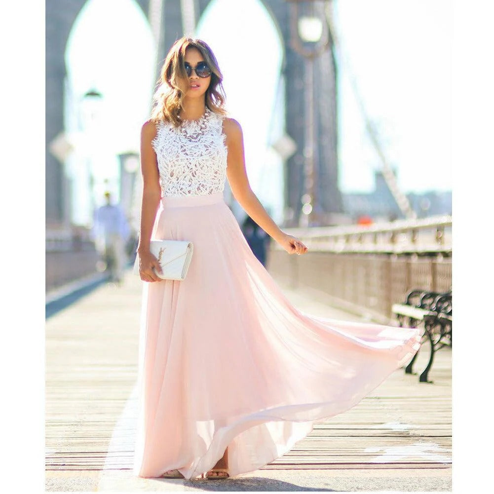Full length pink evening dress featuring a delicate lace bodice for wedding guests