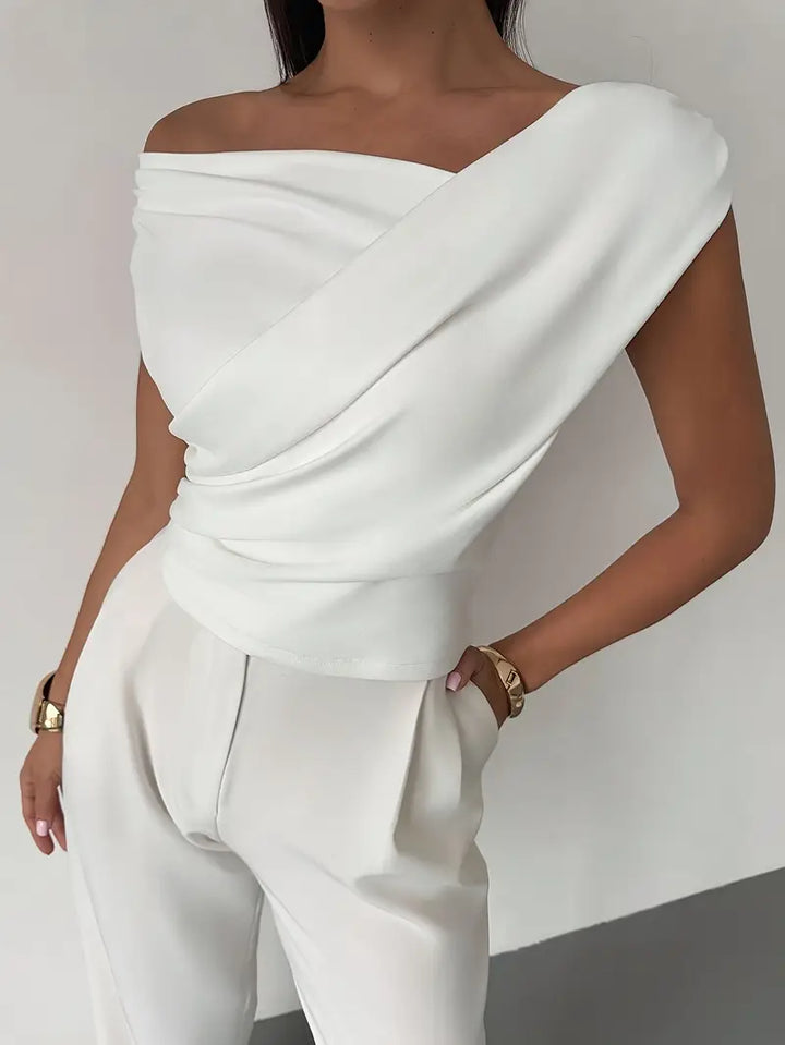Fabric texture and premium stitching detail of the elegant blouse