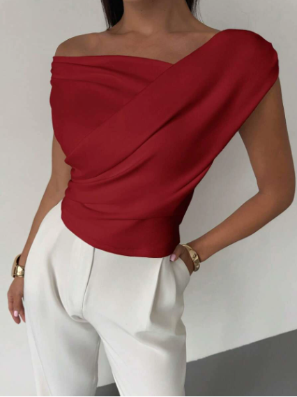 Model wearing red elegant draped shoulder top