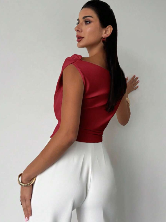 Full outfit perspective featuring the stylish women's draped top