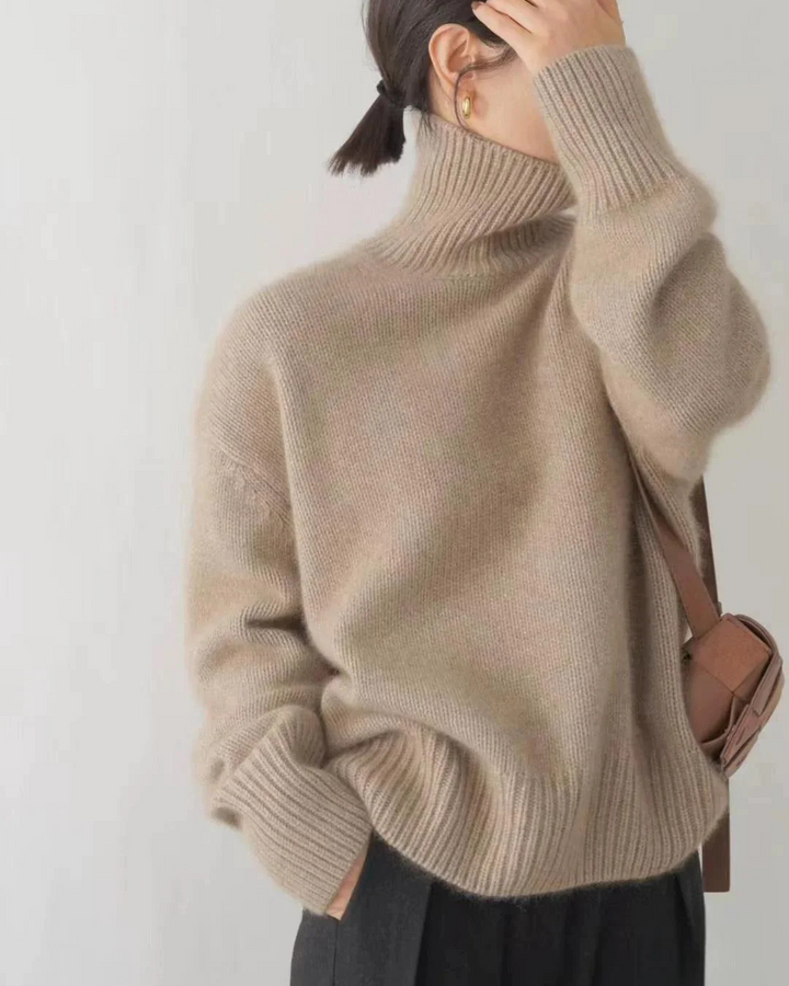 Grey women's knitwear turtleneck jumper showcasing casual chic style.