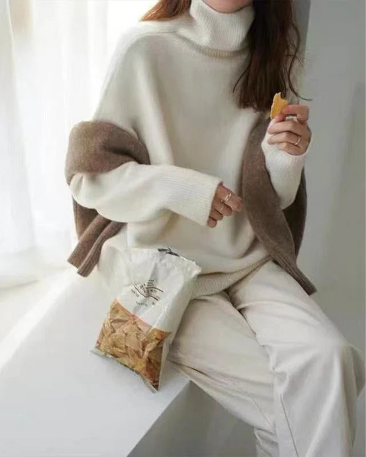 Close-up view of the ribbed turtleneck collar on a stylish women's jumper.