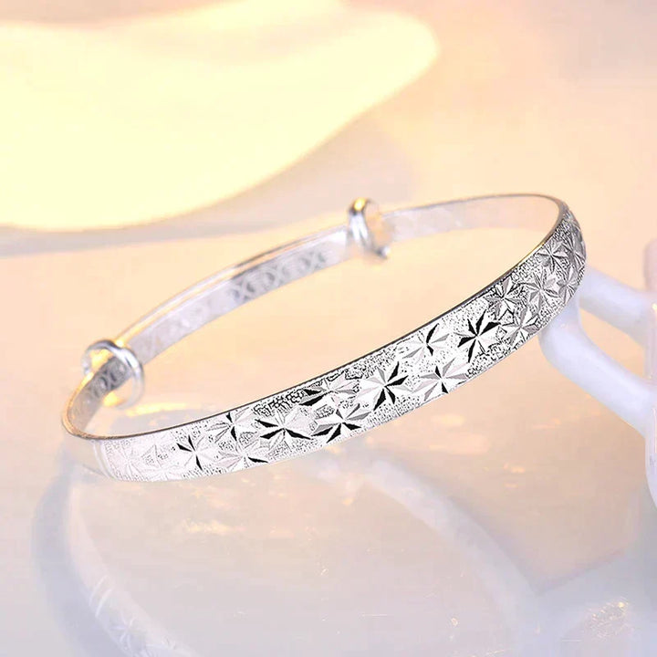 Top down view of the womens jewelry piece showcasing the polished silver finish