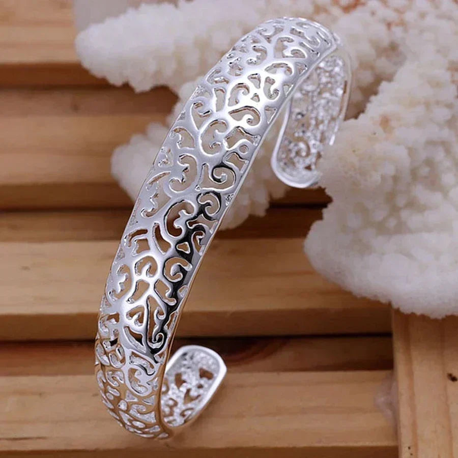 Close-up of the sterling silver filigree bracelet highlighting delicate scrollwork details.
