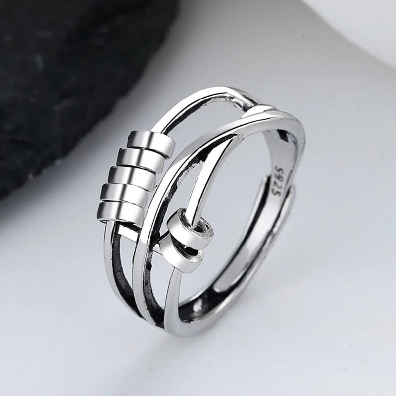 Side angle view of the handmade sterling silver fidget ring with smooth rotating elements.