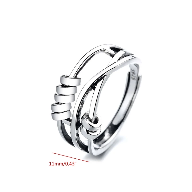 Sterling silver spinner ring for women showing minimalist fidget band design