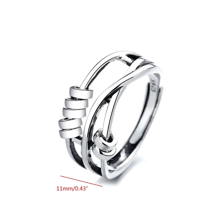Sterling silver spinner ring for women showing minimalist fidget band design