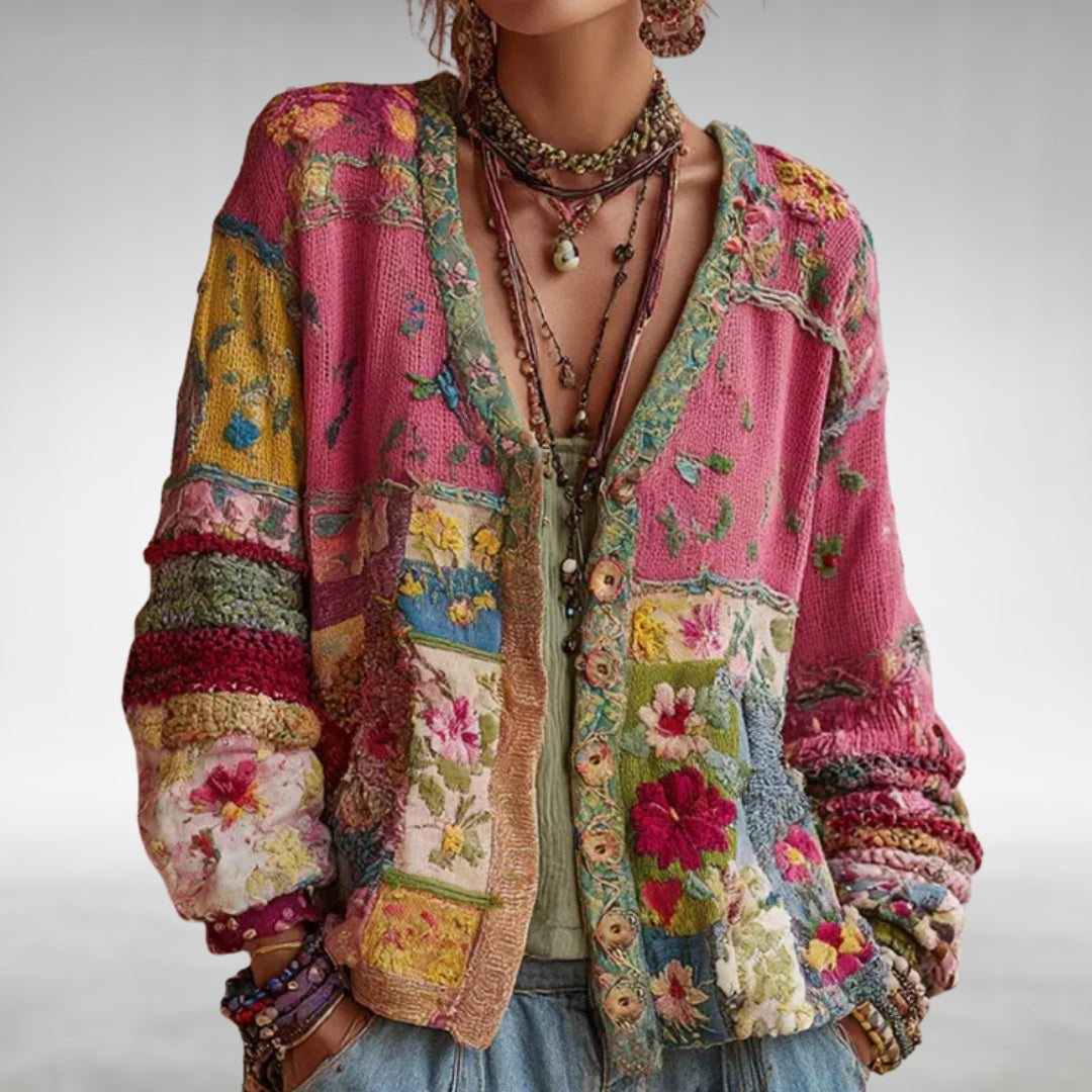 Women wearing a colorful patterned boho knit jacket with layered necklaces