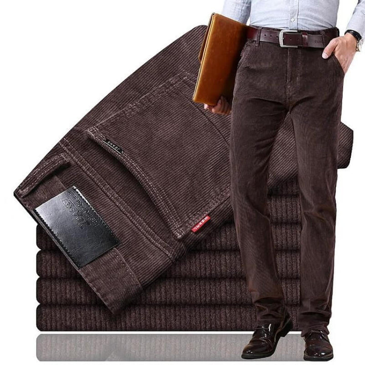 Men's dark brown slim fit textured trousers displayed with leather belt
