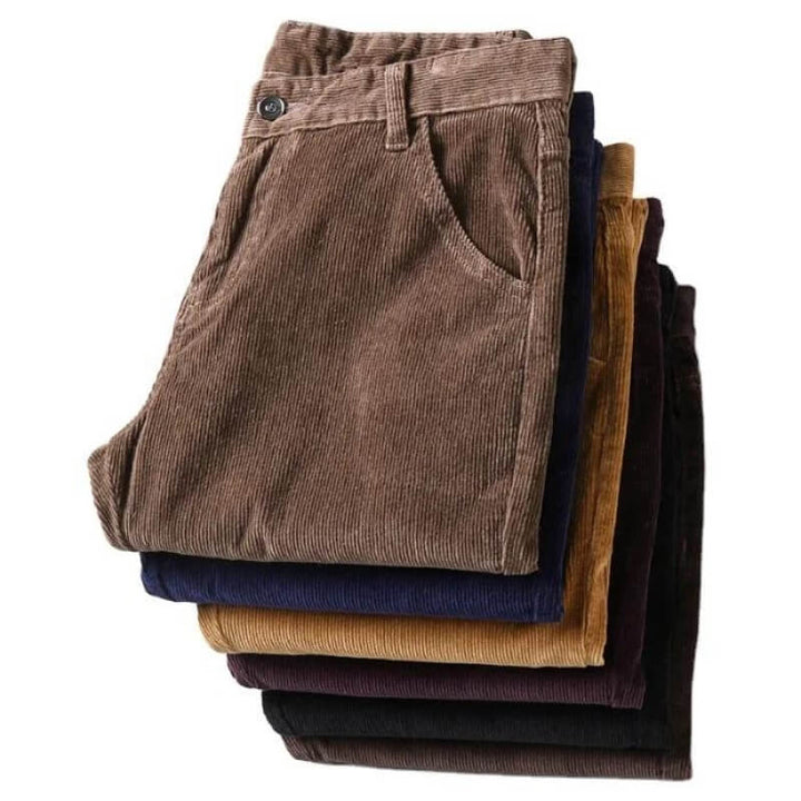Button and zipper closure detail on mens vintage style trousers with slim fit cut