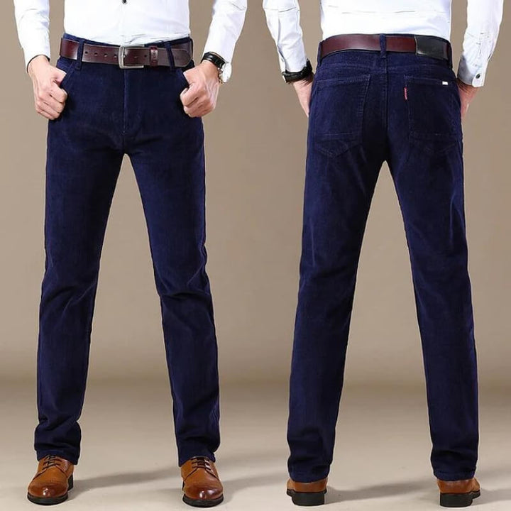Detailed shot of waistband and belt loops on mens vintage style slim fit trousers