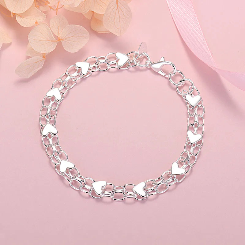 Full circular view of silver heart link chain bracelet