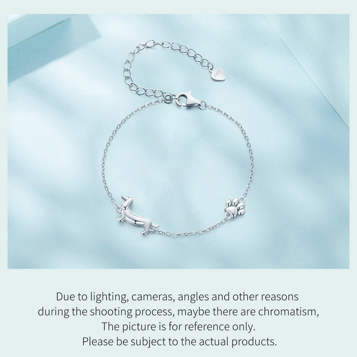 Dachshund charm bracelet displayed on a light blue background