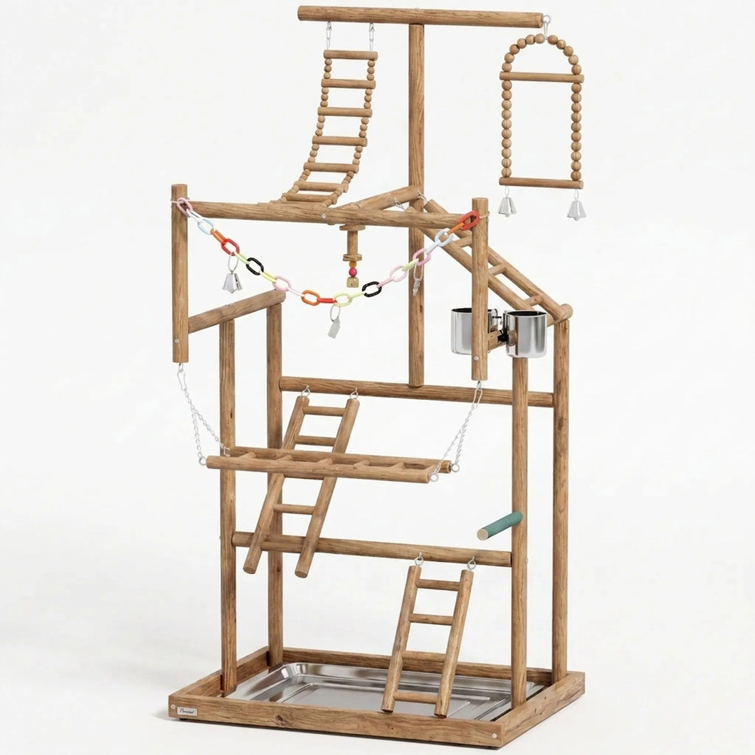 Multi-level wooden bird playground with ladders and toys on a white background