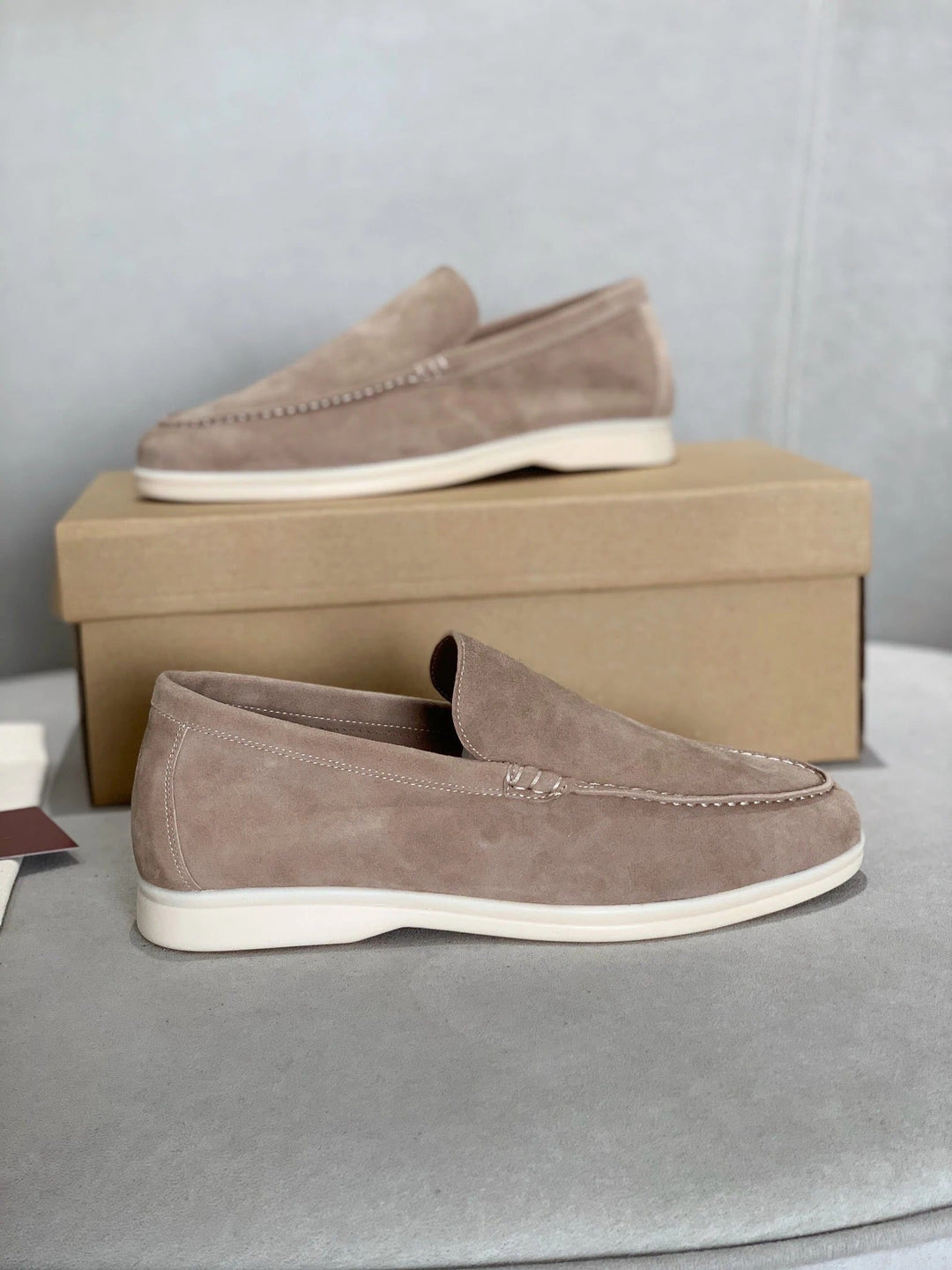 Side angle view of men's classic slip-on casual loafer shoes in soft leather